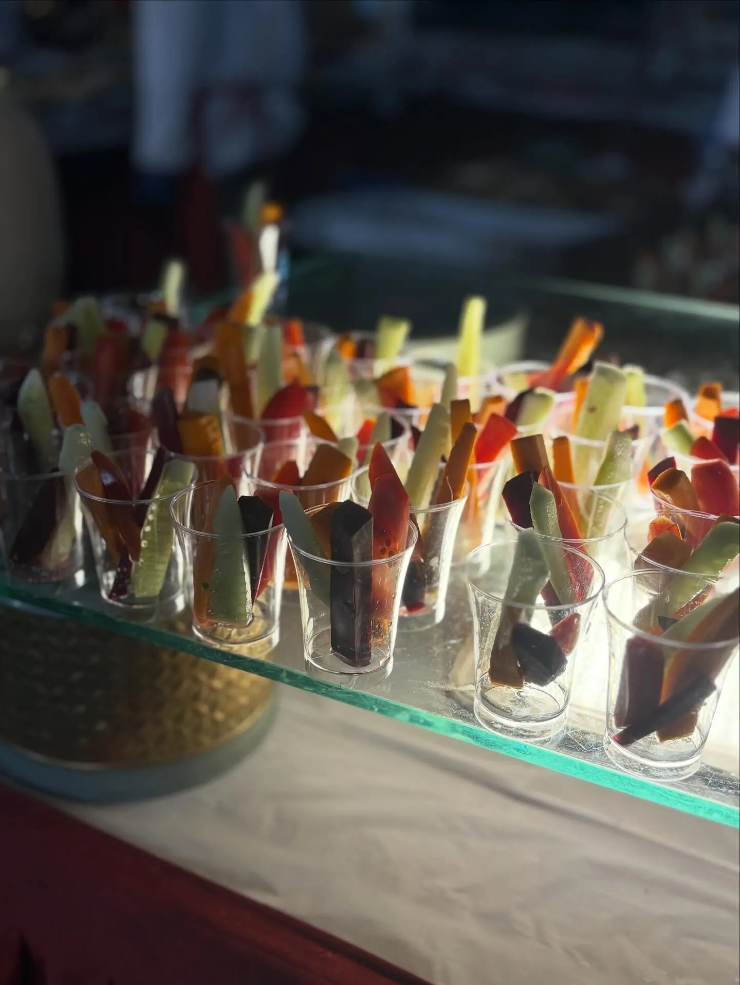Rows of fresh vegetable crudité served in individual glasses